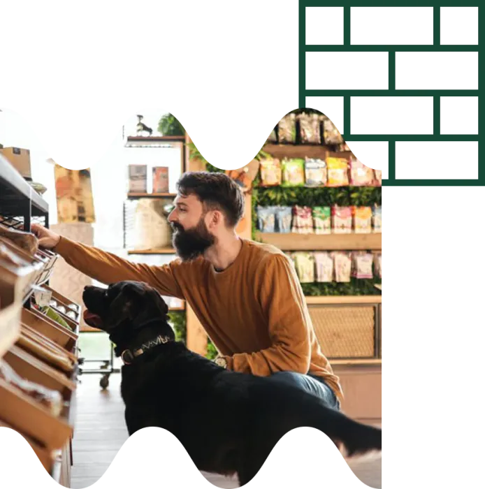 man with his dog in the shop